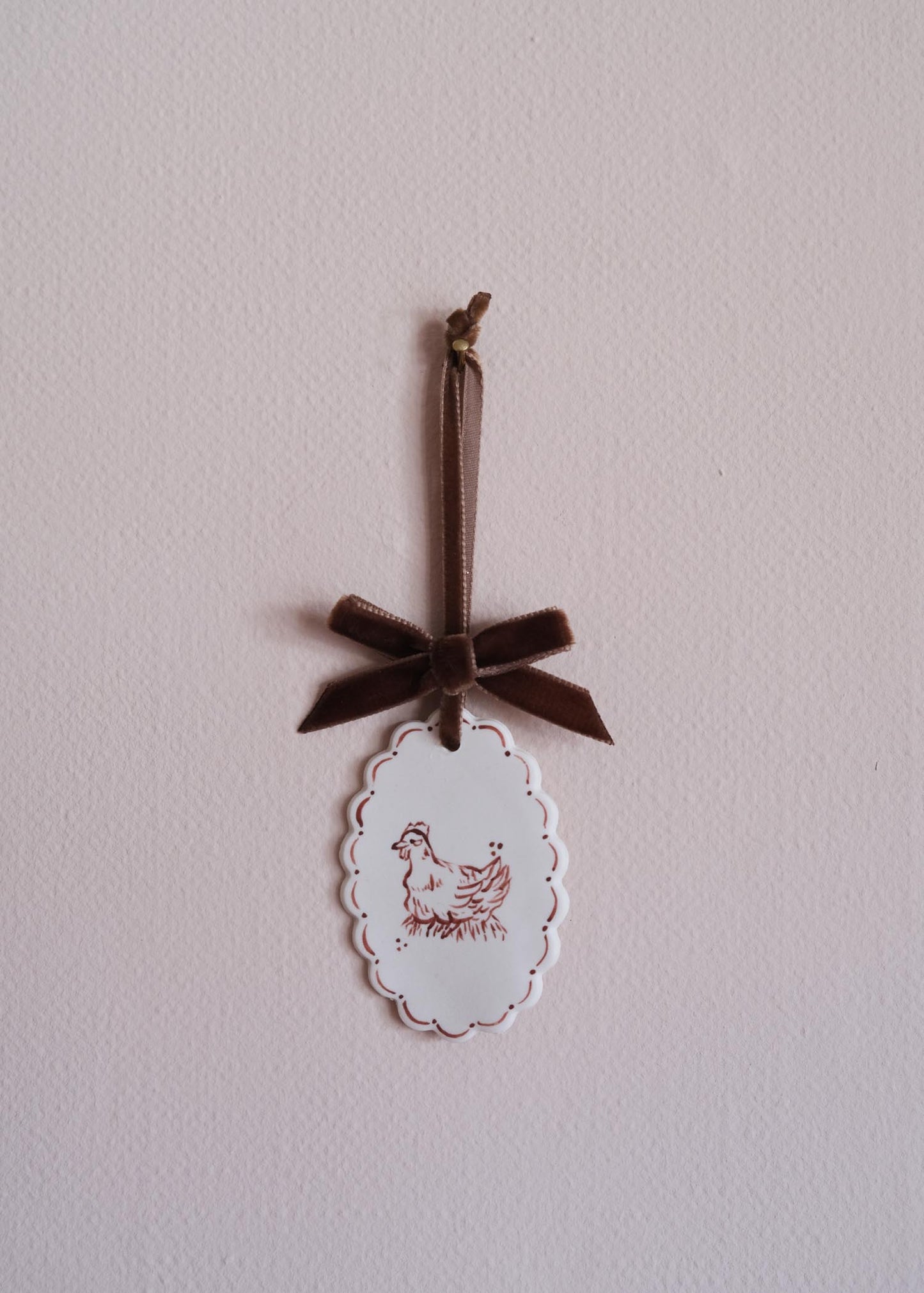 Small brown laying hen wall hanging