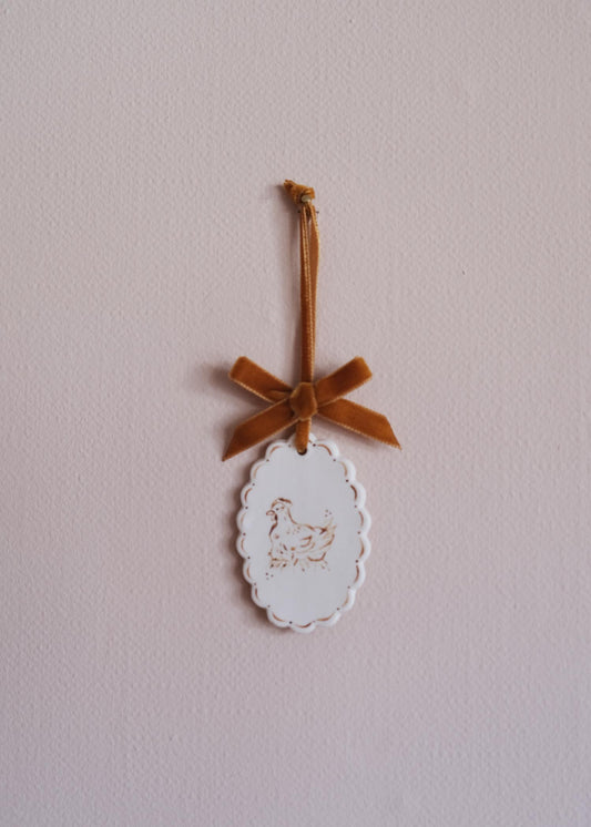 Small golden laying hen wall hanging