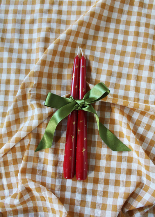 Festive gold star candle