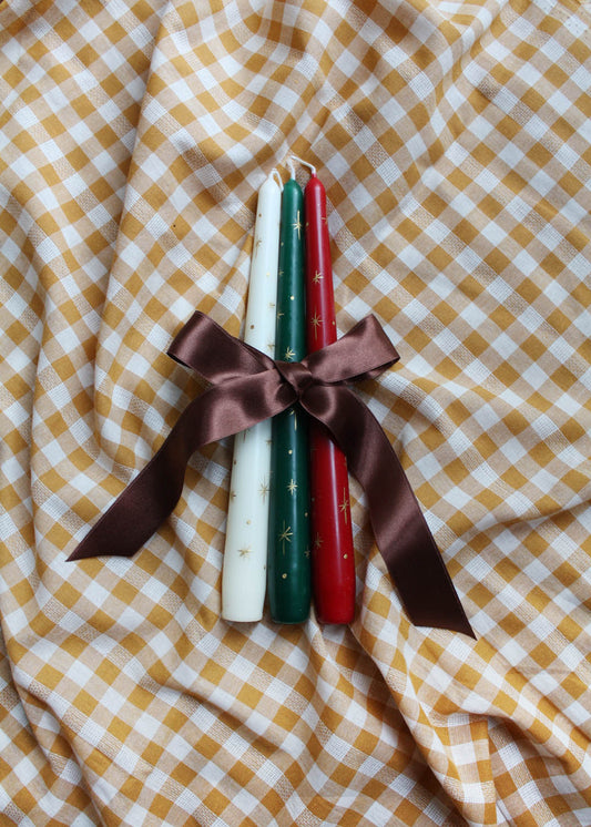 Festive gold star candle