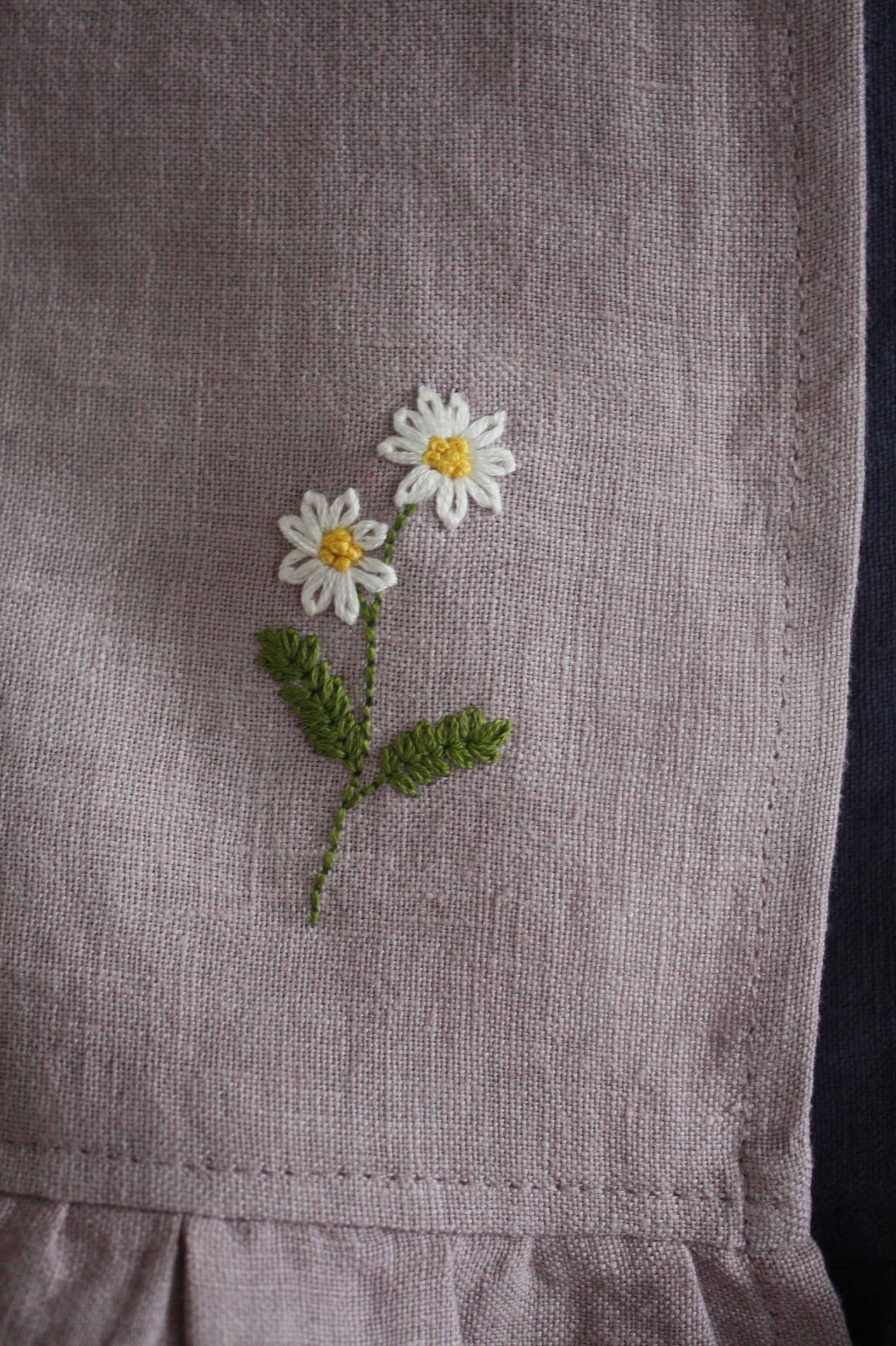 hand embroidered daisy linen ruffle tea towel