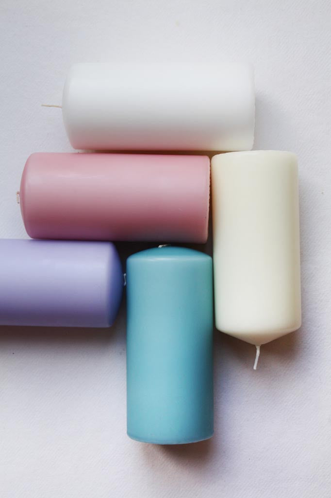 pink, blue, lilac, ivory and white pillar candles