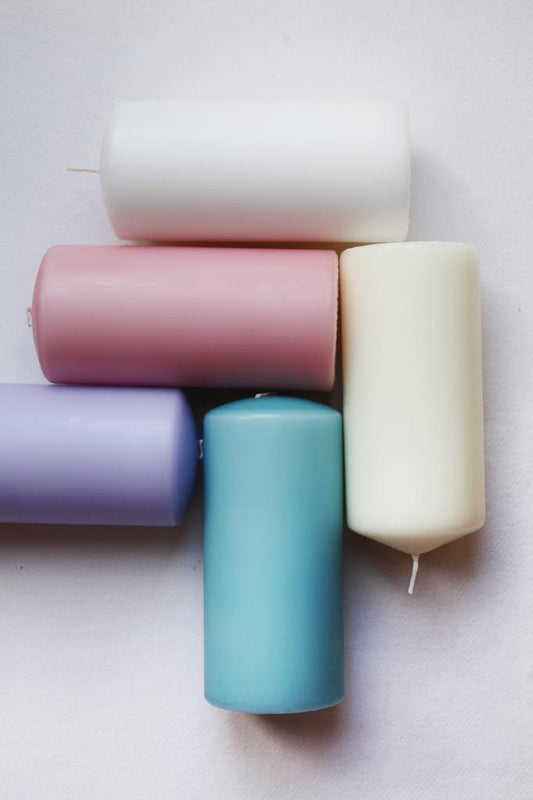 pink, blue, lilac, ivory and white pillar candles